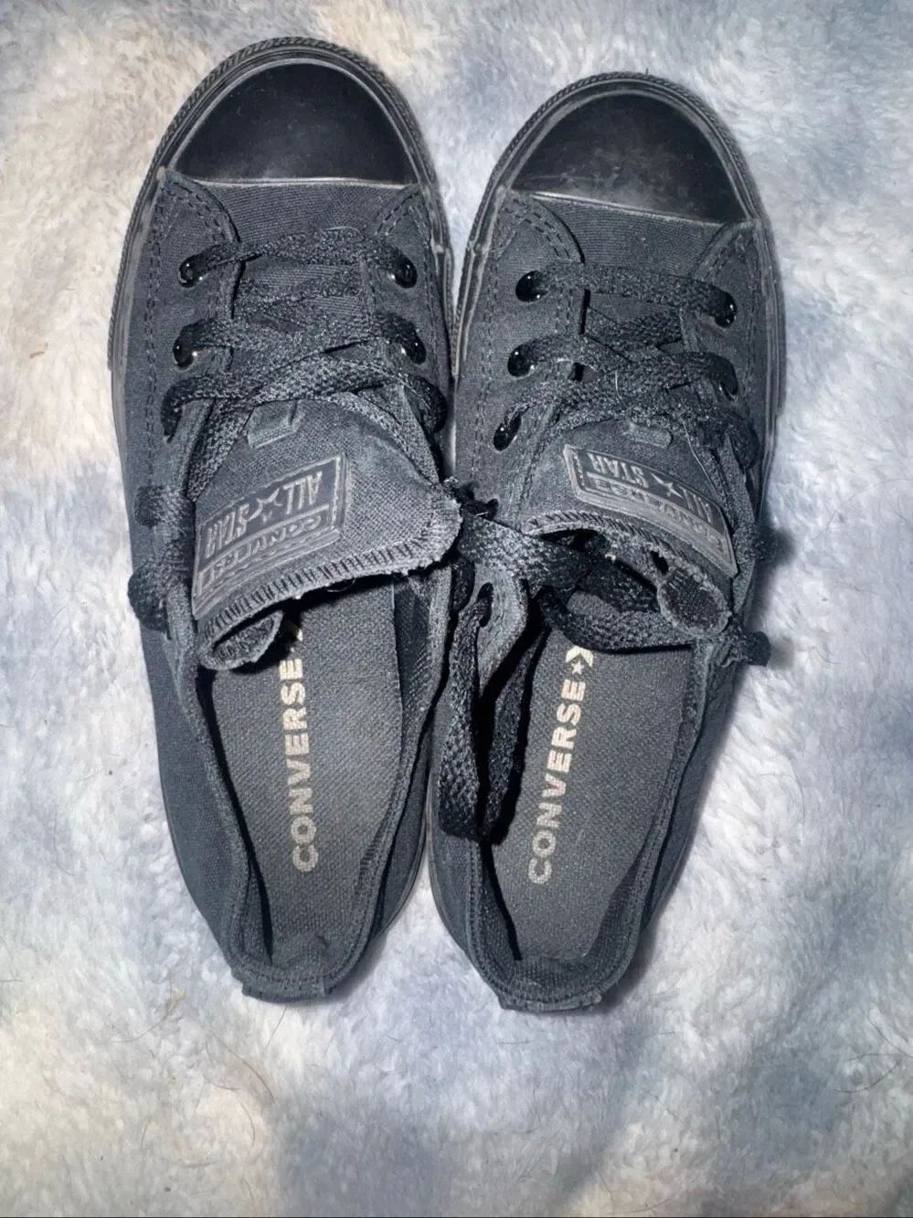 All black low top Converses size youth 3